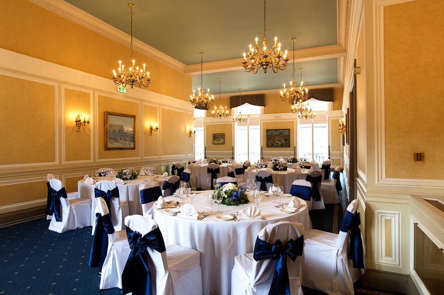 Traditional room with natural light set for dinner