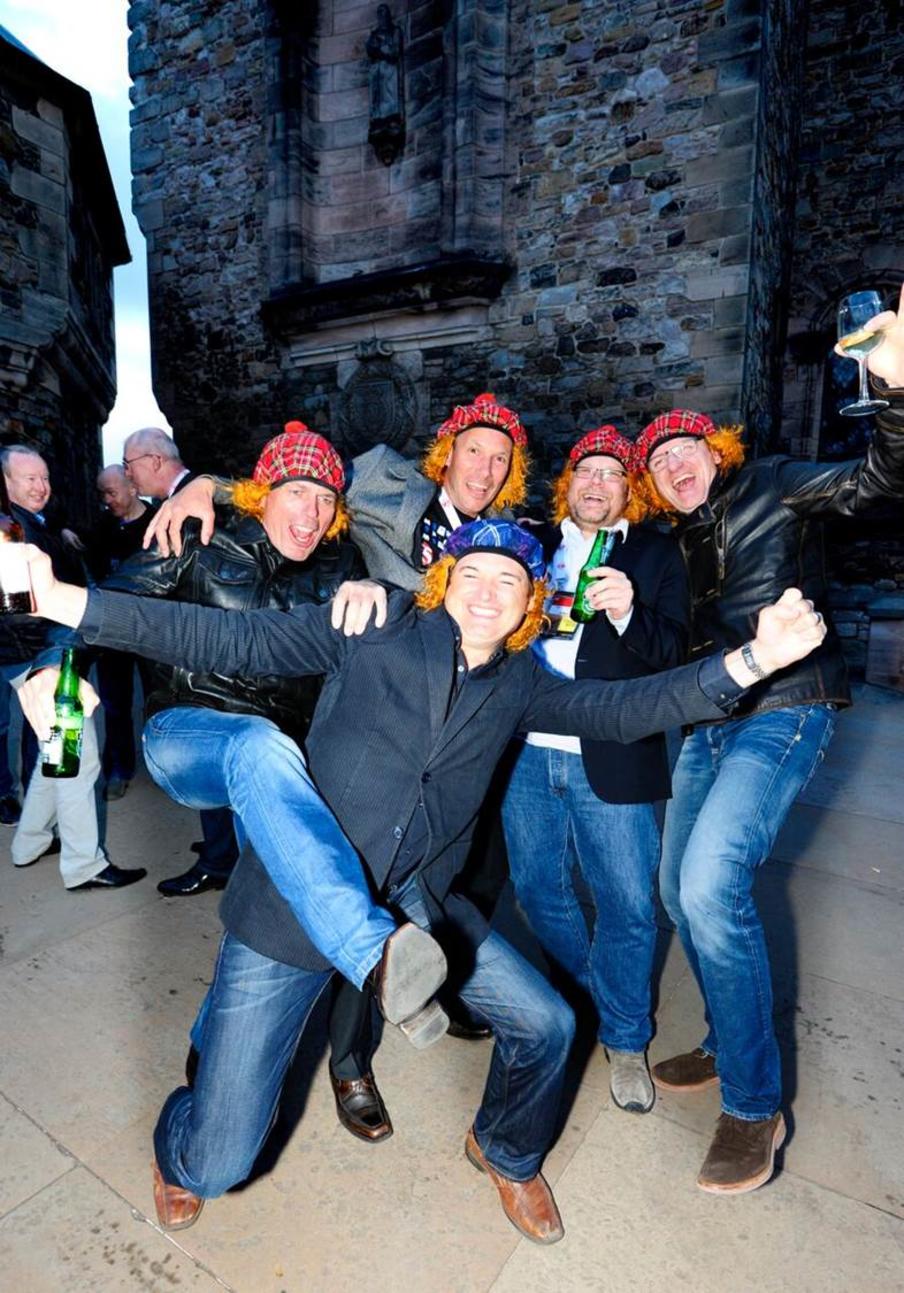 Happy conference delegates in See You Jimmy hats at Edinburgh Castle