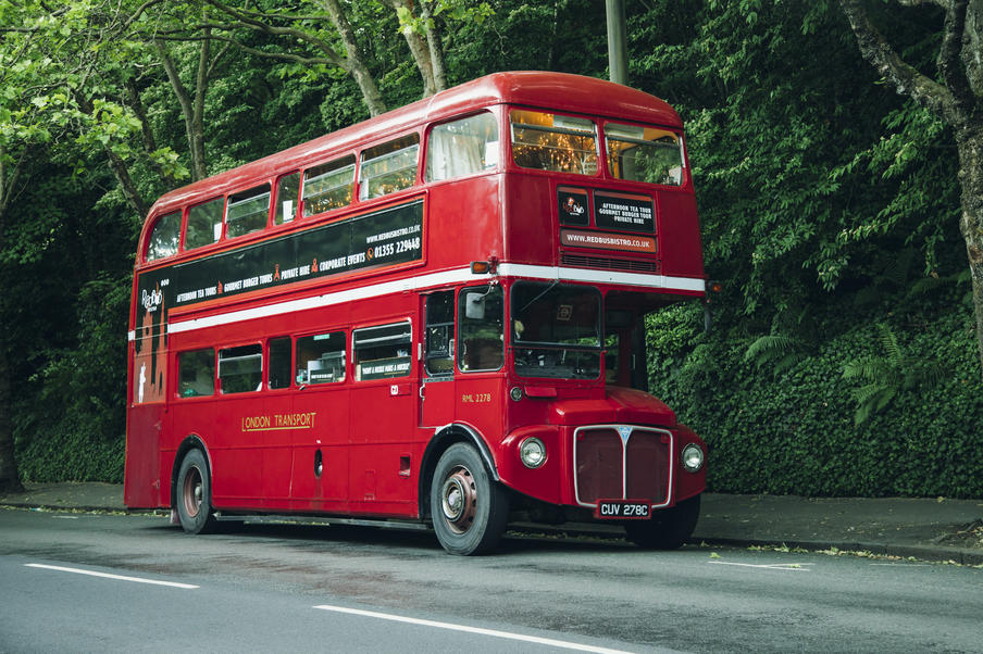 Our striking vintage red bus stands out on the streets of Edinburgh.
