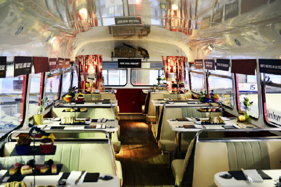 The interior of a 1966 Routemaster bus fitted out as a rolling restaurant