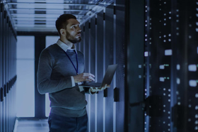 Man inspecting supercomputer