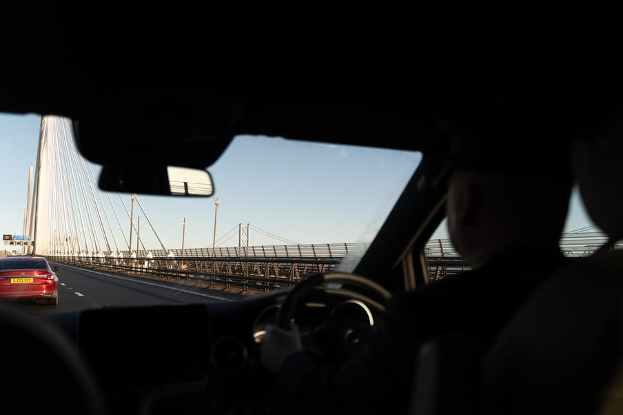 Little's chauffeur driving over the Forth Road Bridge.