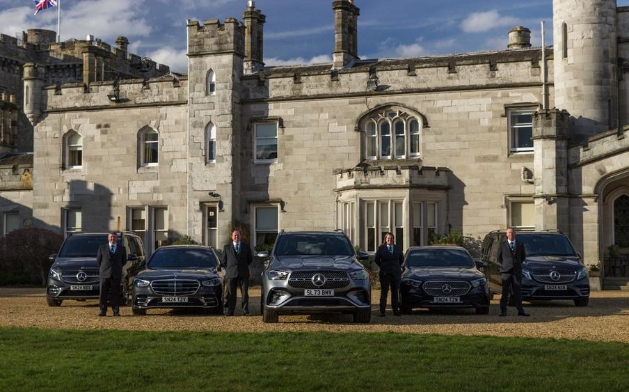 Dundas Castle – A selection of our proud chauffeurs next to some of our cars 