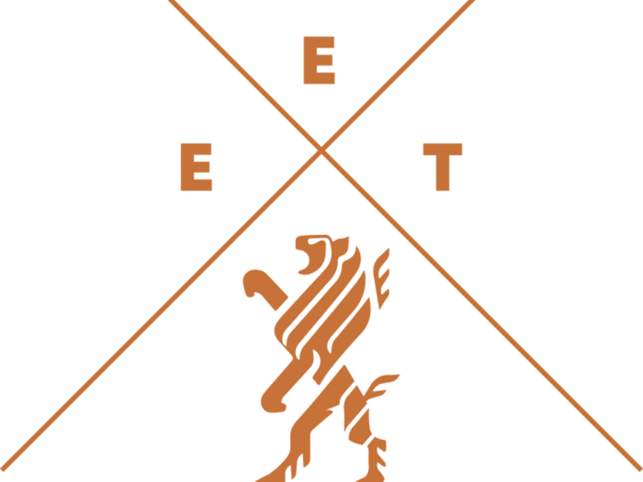 EET logo in orange, with two diagonal lines crossing above a lion with the letters EET above